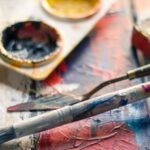 Hobbies - Selective Focus Photography of Paintbrush Near Paint Pallet