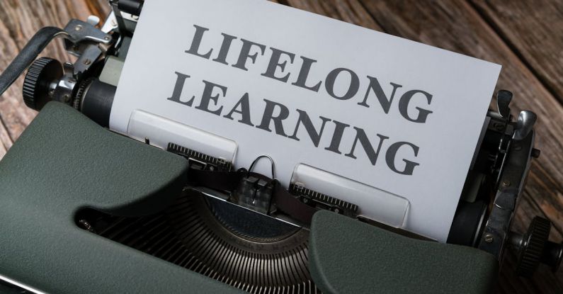 Continuous Improvement - A typewriter with the word long life learning on it