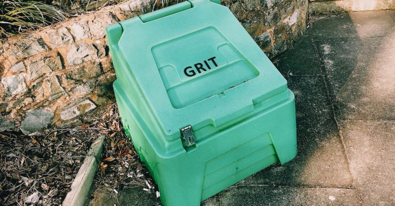 Grit - Container near stone barrier on street