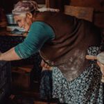 Senior Role - A woman making bread in a kitchen