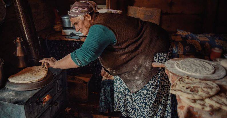Senior Role - A woman making bread in a kitchen