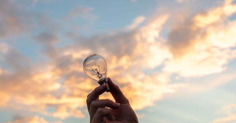 Innovation - Person Holding Clear Light Bulb