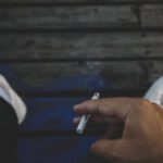 Habits - Person Holding Cigarette Stick